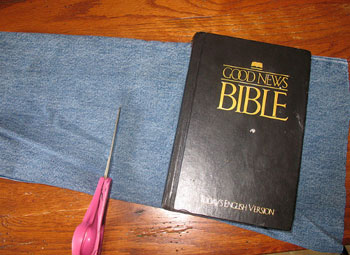 Carefully put Bible on the pant