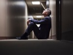 Man sitting in a corridor
