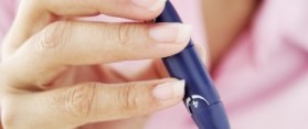 Woman testing blood sugar