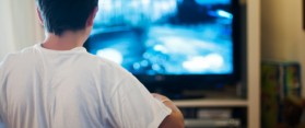Boy playing at television video games