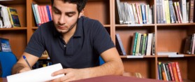 Boy making notes