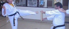 Woman using round house kick