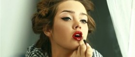 Girl touching up makeup