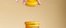 gold coin on stack of coins