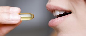 A girl taking Vitamin Supplement