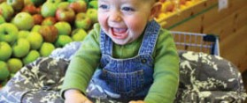 Baby smilling while shopping