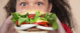 Girl eating Hamburger