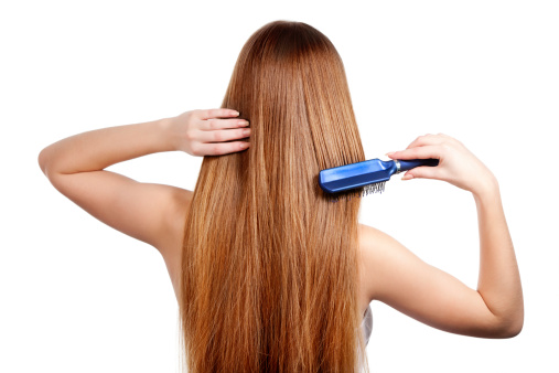 Woman Combing Hair