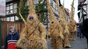 men dressed in straw