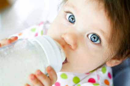 baby using bottle