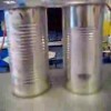 2 empty tin cans