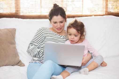 Kid playing game on a laptop