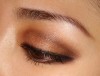 Applying Dark Brown Eyeshadow