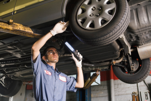 mechanic checking a car