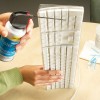 Spraying compressed air on a keyboard