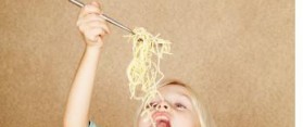 Girl eating Spaghetti