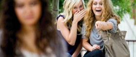 girls laughing at a girl