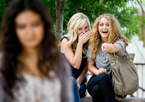 girls laughing at a girl