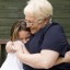 Senior woman hugging granddaughter