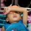A boy with dengue disease sleep on a bed