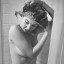 An unexposed nude woman in the shower wa