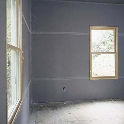 hanging drywall on a Cinderblock wall