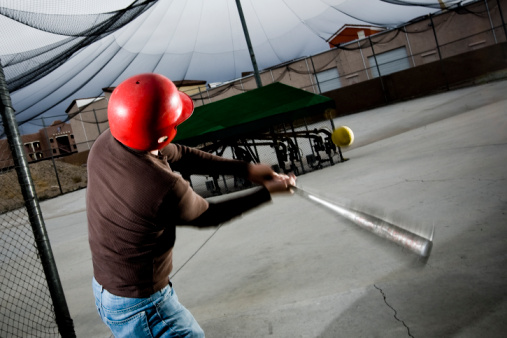 Boy hitting a ball