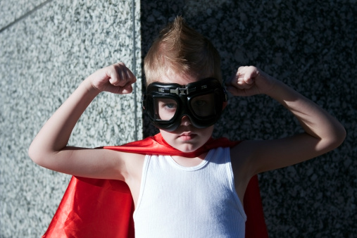 Little boy acting super hero