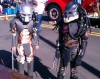 Two boys wearing predator costumes