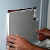 Placing the patch in drywall opening