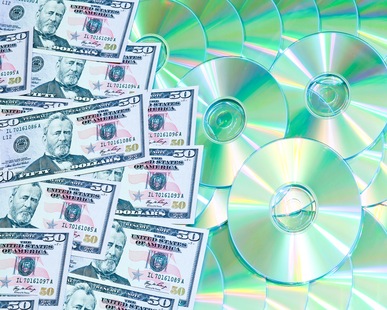 background of digital discs and money media market concept