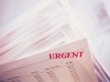 A paper with urgent written on it