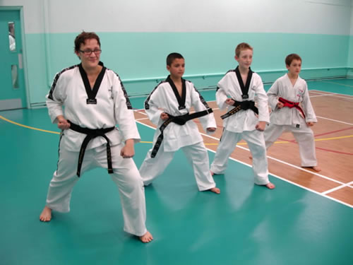 performing a low block in taekwondo