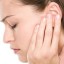 A woman suffering from ear congestion