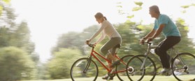 Couple riding bicycles together