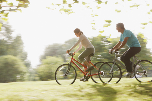 Couple riding bicycles together