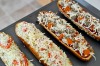 Preparing French bread pizza