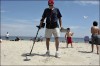 Using a metal detector at the beach
