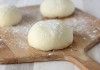 Pizza dough on a baker's peel