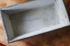 Greased and floured loaf tin