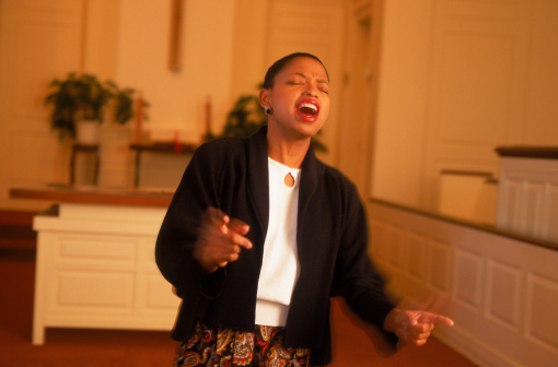 Woman gospel singer in chapel