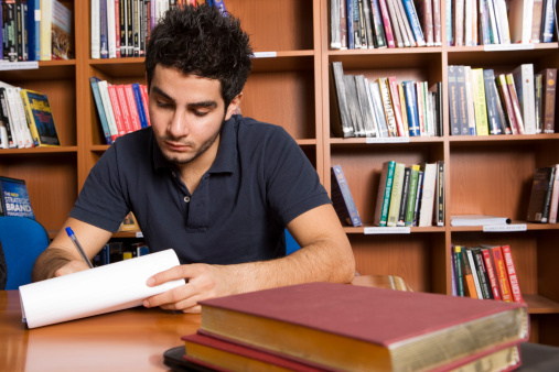 Boy making notes