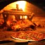 Pizza in Wooden Oven