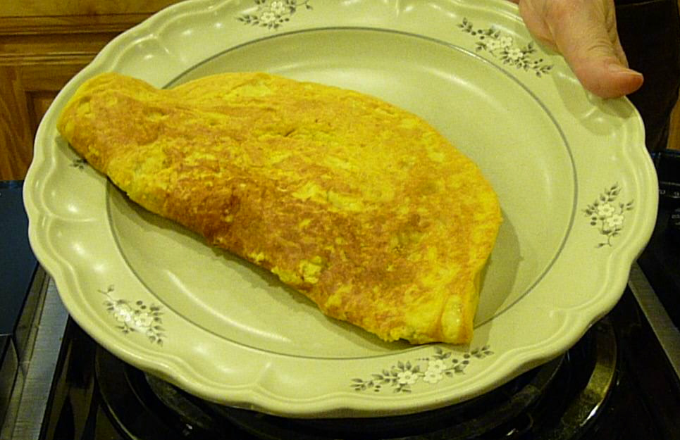 Omelette rolled into a plate