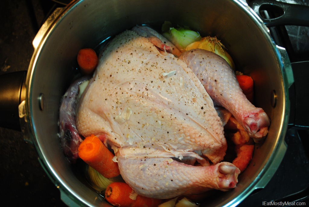 White chicken being cooked in cooker