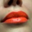 Lips with orange lipstick