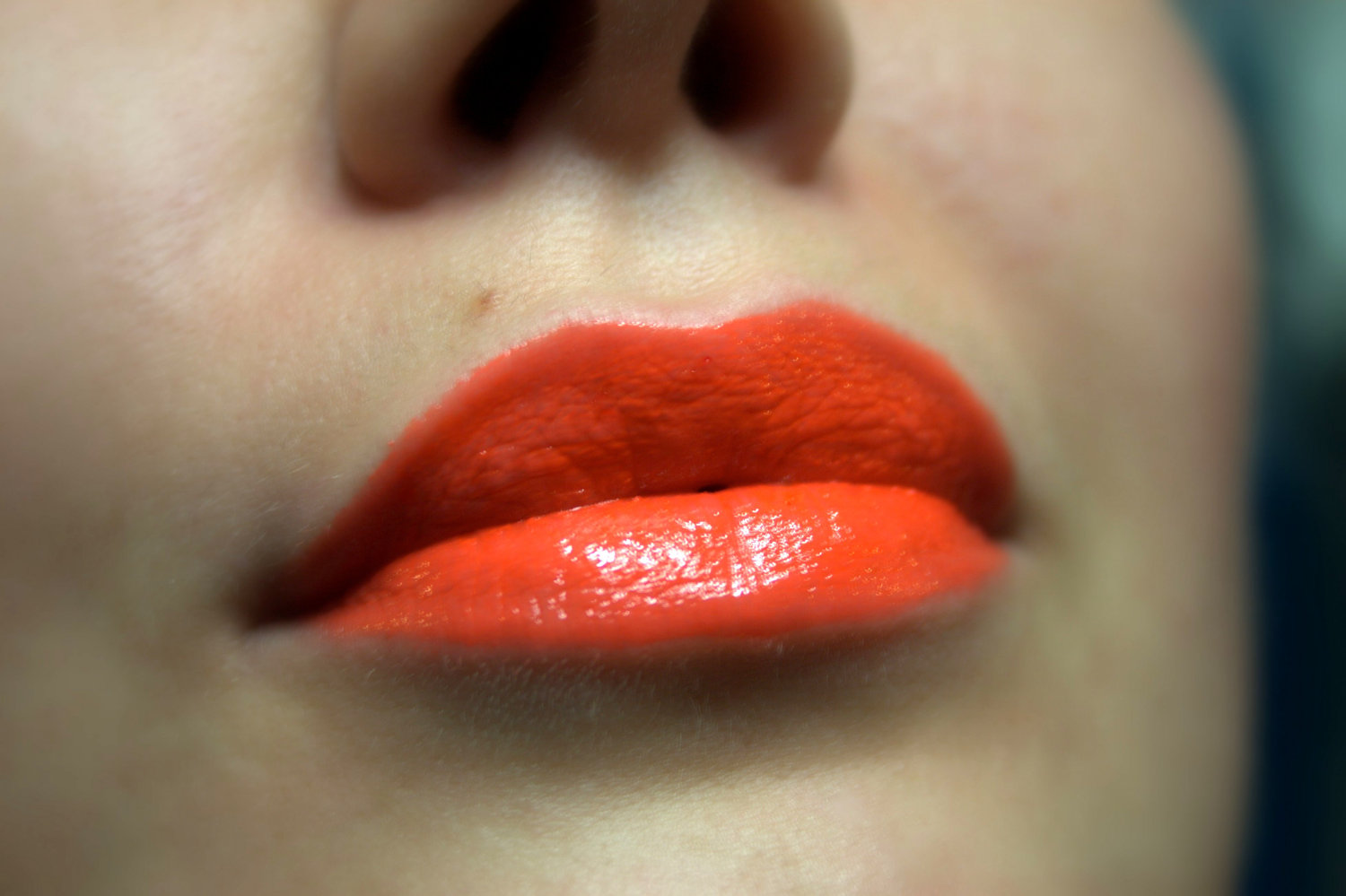 Lips with orange lipstick