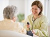 Healthcare worker taking blood pressure