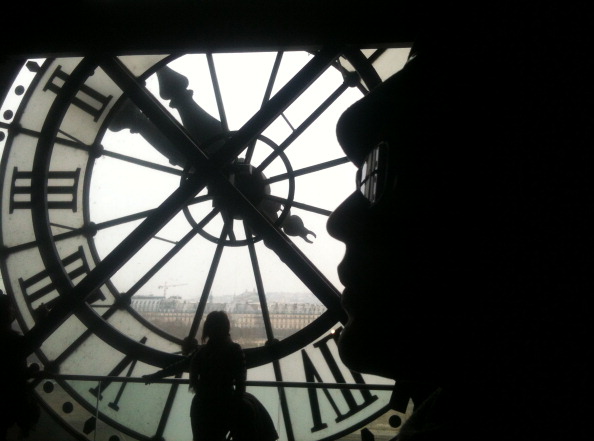 Woman looks at the clock