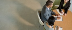 office workers at meeting table